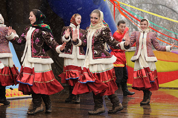 Orel, Russia - March 13, 2016: Maslenitsa, Pancake festival. Girls dancing in Russian traditional winter suits horizontal